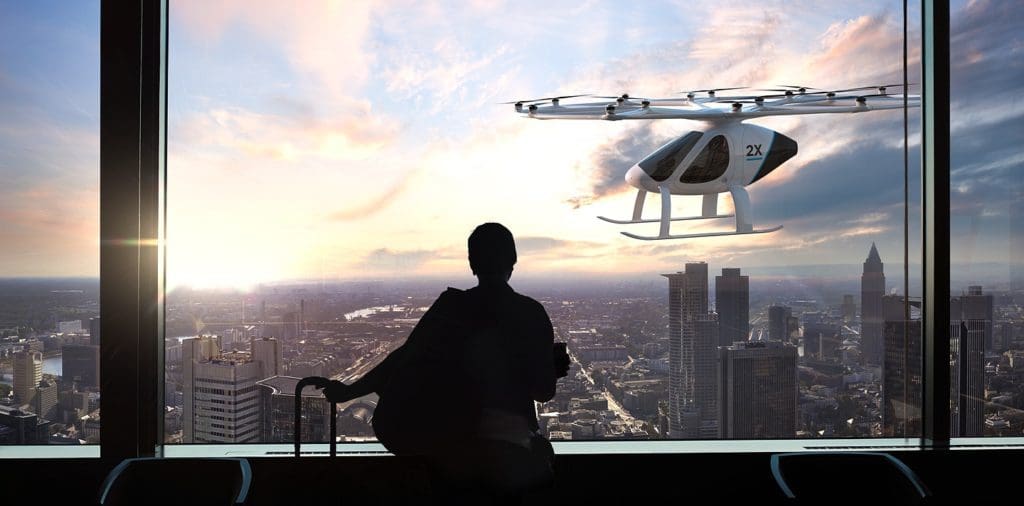 man looking at helicopter