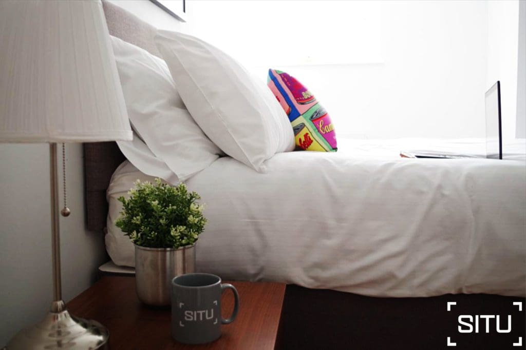 Mug and Laptop by Bed.