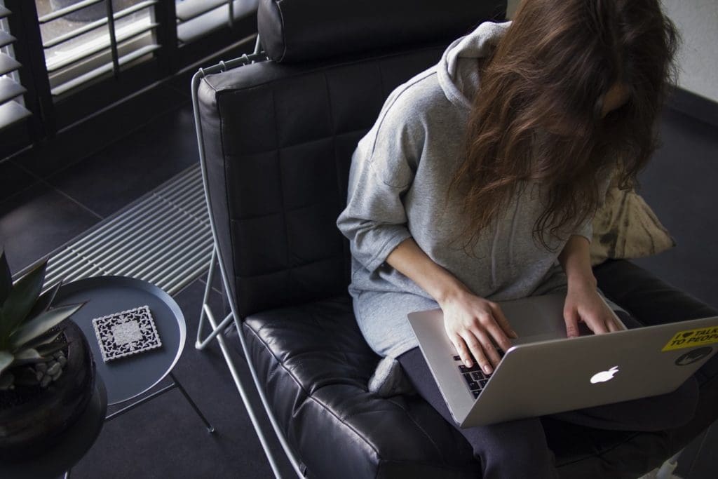 A person sitting and using a computer.