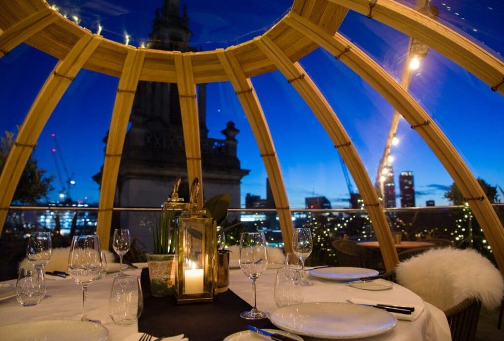 Dining table inside an igloo at bar Mercer Roof Terrace. 