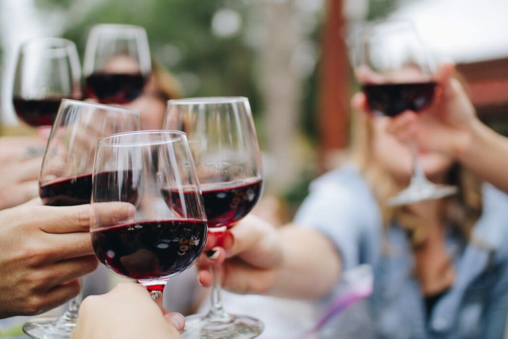 People toasting with wine.