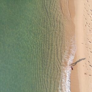 Person standing on a beach in Barcelona