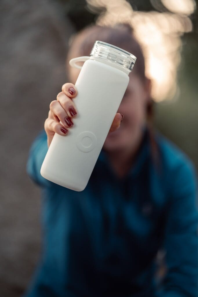 Reusable drinking bottle to help with sustainable travel essentials.