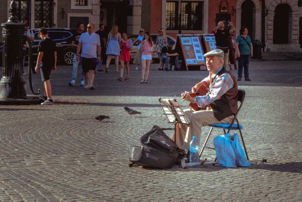 Musician playing on The Square in Krakow.