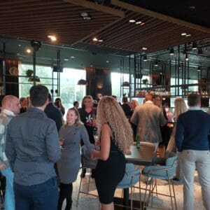 Partners enjoying and mingling in the Amsterdam Be More Starfish road show