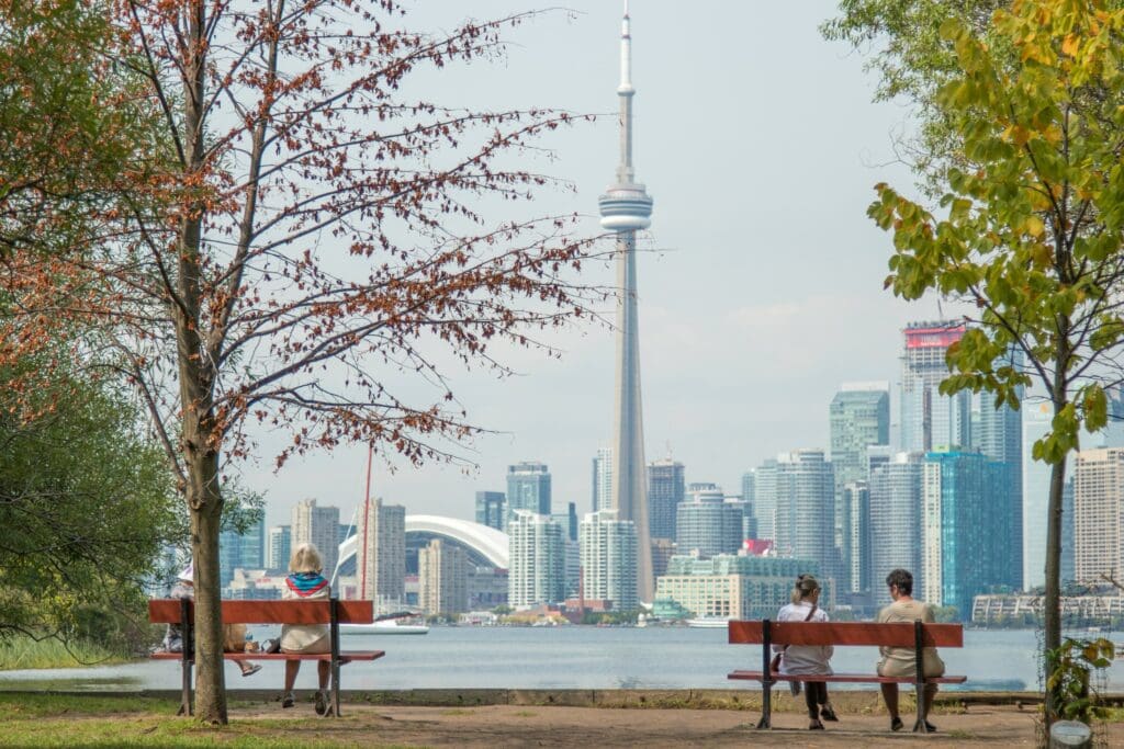 People sitting in a park in Toronto, Canada