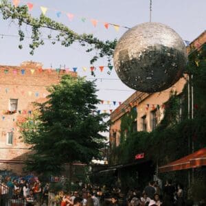 Fascinating streets with a big party ball and flags' decoration.