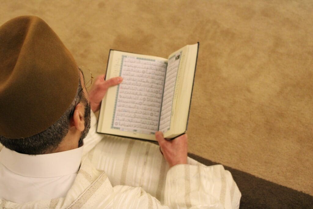 person reading the Quran