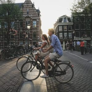 People on bicycles in Amsterdam - business events in Amsterdam