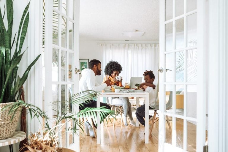 family having breakfast - relocating families