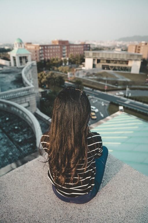 Girl sitting on a roof