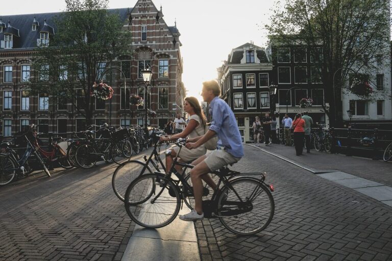 People on bicycles in Amsterdam - business events in Amsterdam