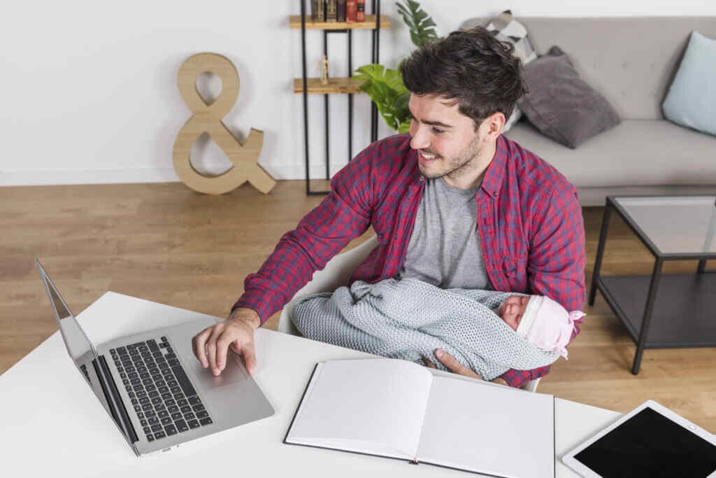 father and baby working