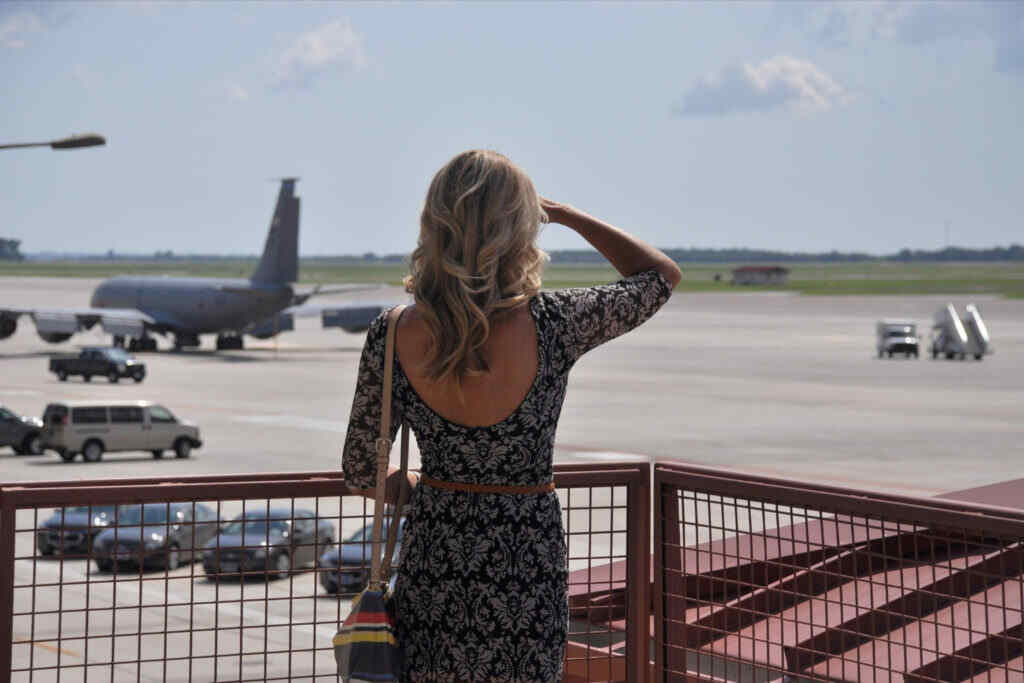 woman looking at aeroplanes