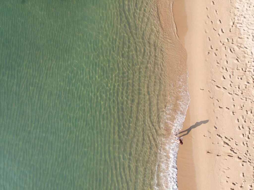 Person standing on a beach in Barcelona