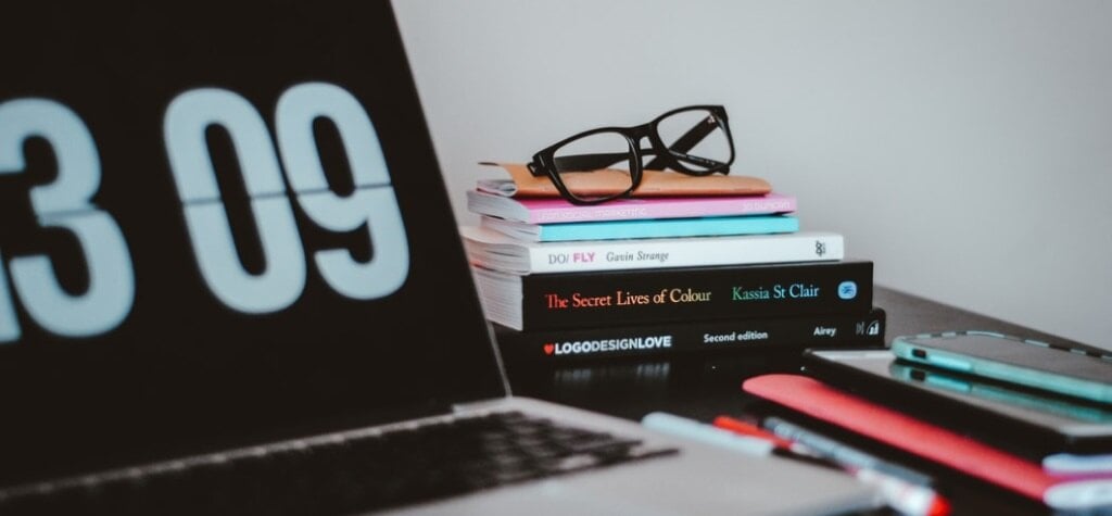 Laptop, books and glasses