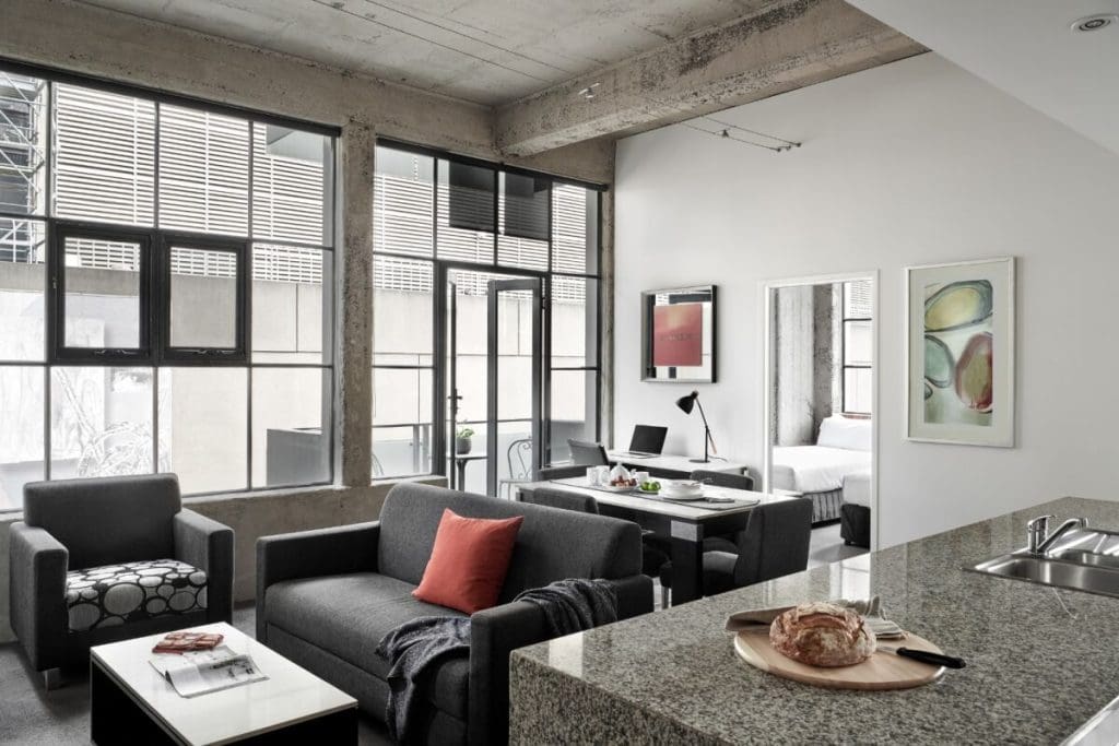 Punthill Manhattan Apartments - Situ serviced apartments - lounge room and office space