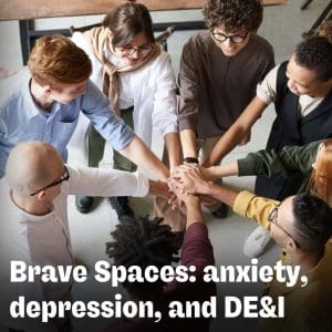 People standing in a circle holding hands