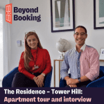Jessica from Situ and Solomon from The Residence smiling beneath the Beyond Booking logo