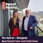 Jessica from Situ and Craig from The Spires in Glasgow standing on a balcony